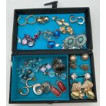 A small fabric jewellery box containing 20 pairs of vintage and modern costume jewellery earrings in