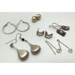 6 pairs of silver earrings in stud and drop styles. To include multicoloured crystal set half hoops,