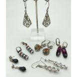 6 pairs of silver and white metal drop style earrings, mostly stone set. To include floral design