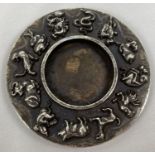 A Chinese white metal inkstone with the 12 zodiac animals to outer rim. Impressed mark to underside.