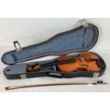 A standard sized Skylark violin, complete with bow, rosin & blue felt lined hard carry case.
