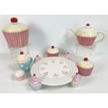 A quantity of assorted modern novelty cupcake design kitchen ceramics. To include: cake stand,