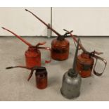 5 vintage metal oil cans. 4 red painted lever style cans together with a dome style long spouted