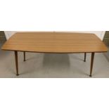 A 20th century design wood grain effect Formica topped coffee table with screw on legs. Approx. 42 x