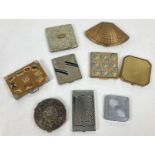 A collection of 9 vintage powder compacts in varying designs and sizes to include a suitcase and fan