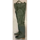 A pair of new waterproof fishing waders with adjustable elasticated braces. Size 7.