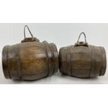 2 vintage small wooden alcohol barrels both with metal banding. Top stoppers missing. Largest