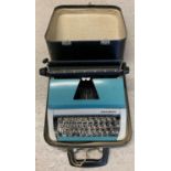 A vintage cased Lilliput Child's typewriter in blue & grey. In lovely original condition. Complete