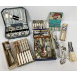 A box of assorted vintage boxed & unboxed cutlery items. To include: cased fruit spoon set, boxed