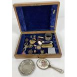 A wooden box containing a mixture of vintage items to include a Limoges hand mirror, Fattorini