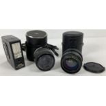 A cased Chinon 1:28 f=28mm Multi Coated lens together with a cased Makinon Multi Coated 1:28 f=