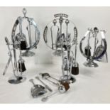 A collection of 6 mid century chrome fireside companion sets. To include novelty horseshoe shaped