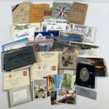 A box of assorted vintage ephemera to include postcards, Forces Mail letter cards, first day