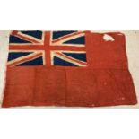 A vintage United Kingdom red ensign flag. Shows signs of age related wear and repairs. Approx. 126 x