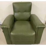 A large 20th century design green vinyl covered reclining arm chair with side pull out tray. On
