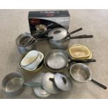A box of assorted vintage cookware together with a modern boxed Swan 3 piece saucepan set. Vintage
