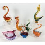 A collection of 7 assorted coloured art glass bird figurines.