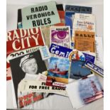 A collection of offshore pirate radio station ephemera. To include: posters, stickers, postcards,