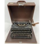 A vintage Imperial "The Good Companion" typewriter with Royal Crest, in wooden carry case.