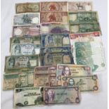 A collection of 29 assorted foreign bank notes. To include notes from: Nepal, Thailand, Singapore,