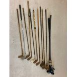 A collection of vintage golf irons, drivers and putters in varying conditions. To include examples