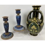 A pair of Doulton Lambeth stoneware candlesticks together an Art Nouveau vase. Blue and brown