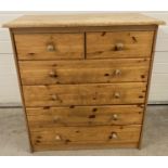 A vintage pine 2 over 4 chest of drawers with knob handles. Solid wood drawers with board bottoms.