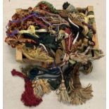 A box of vintage and modern tassels, braids and decorative edging material for upholstery work.