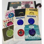 A vintage record folder containing 11 vintage film and TV soundtrack 7" singles. To include "A