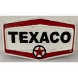 A hexagonal shaped painted cast metal Texaco wall plaque, with fixing holes. In black, white and