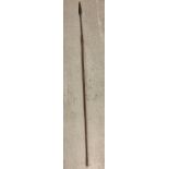 A vintage wooden long handled tribal spear. Total length approx. 141cm.