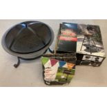A boxed new and unassembled 43cm kettle BBQ. Together with a fire pit with grill and an unopened bag