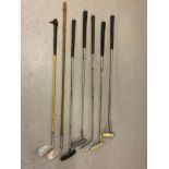 A collection of vintage golf putters and irons in varying conditions. To include Bay Hill by