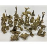 A collection of vintage brassware to include various bells, ivy leaf pin dishes, deer figurines,