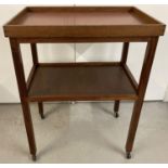 A vintage teak 2 tier tea trolley, top shelf is a removeable butlers tray. Approx. 89 x 69 x 46 cm.