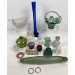 A collection of antique and vintage glassware. To include a rolling pin, novelty egg cups, long