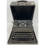 A vintage manual Olivetti Studio 42 typewriter with British Olivetti Ltd. Glasgow nameplate to