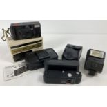 A boxed Goldline Supreme AFP F4.5/35mm camera with case and instructions. Together with a Canon