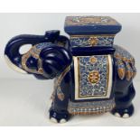 A vintage ceramic jardinière stand in the form of an elephant. With deep blue glaze and light blue &