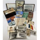 A box of assorted vintage ephemera to include stamps, photographs, cigarette cards and pamphlets.