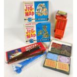 A small collection of vintage toys and games. To include 2 boxed Waddington's Shaped Jig-Maps, boxed