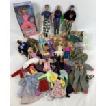 A quantity of assorted Action Man, Barbie, Disney and other dolls, clothes and accessories. To