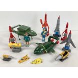 A collection of modern plastic Thunderbirds vehicles and figures.