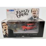 A boxed diecast #00802 Fawlty Towers Austin 1300 Estate & Basil Fawlty figure, by Corgi. Complete