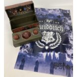 A boxed Harry Potter Collectible Quidditch set with poster. Box in the style of a travelling trunk