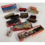 A box of vintage railway O and OO gauge wagons and accessories. To include boxed Girder Bridge,