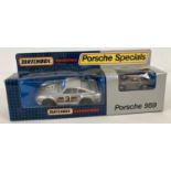 A boxed KS09 Matchbox Superkings Porsche 959 duo set. With original interior packaging.