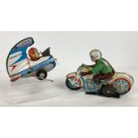 2 vintage Tin Plate Toys. A Japanese Jet Acrobat Plane by Alps in play worn condition (a/f).