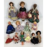 A collection of assorted vintage small and miniature plastic dolls.