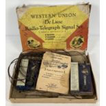 A vintage Western Union De Luxe Radio-Telegraph Signal Set with instructions. Box has age related